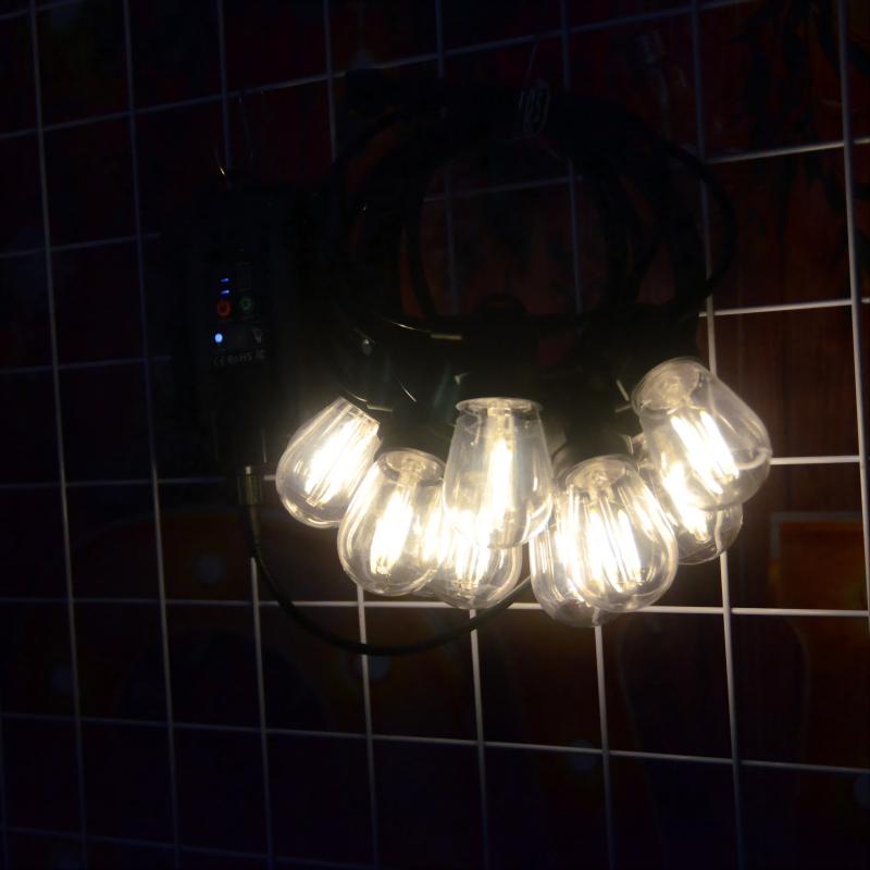 Solar powered LED incandescent outdoor string lights